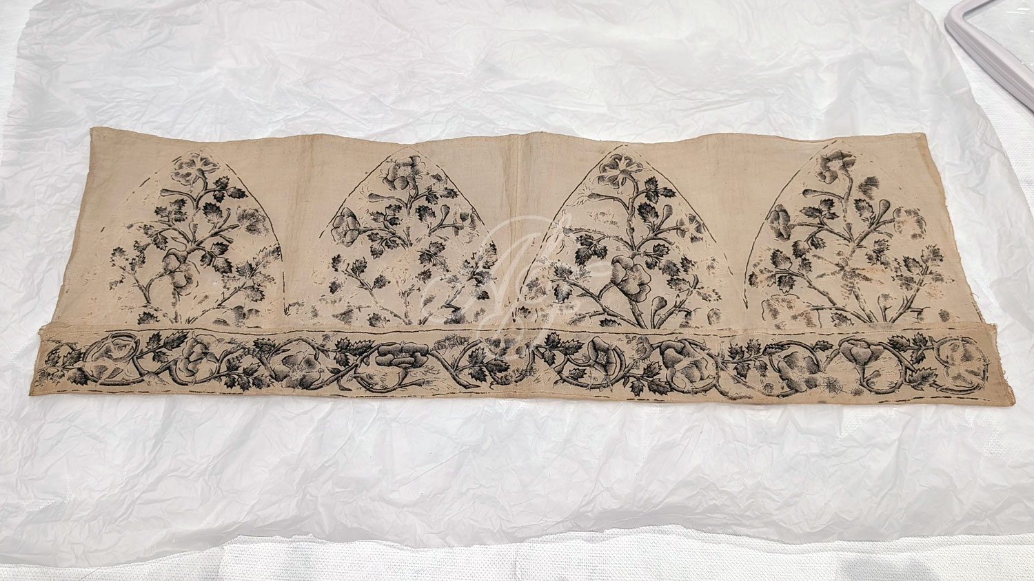 An unfinished Jacobean men's cap, finely embroidered in blackwork foliage and unfinished