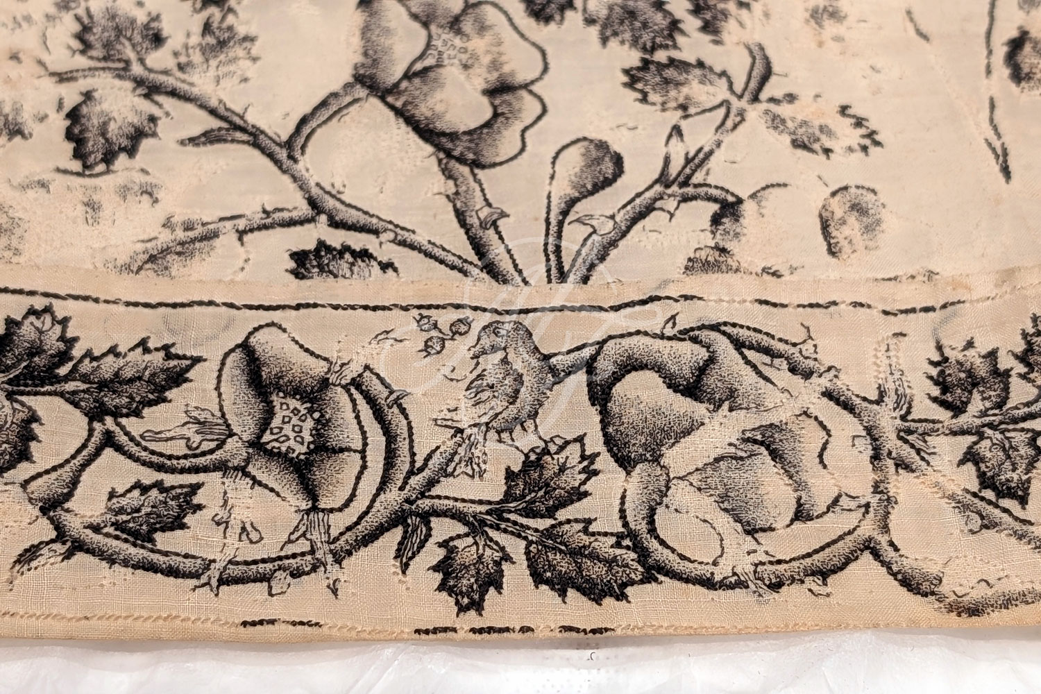 Closeup of the stitching on a blackwork embroidered men's cap from the early 1600s
